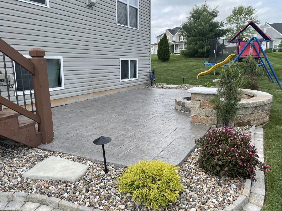 concrete patio in a house with large backyard